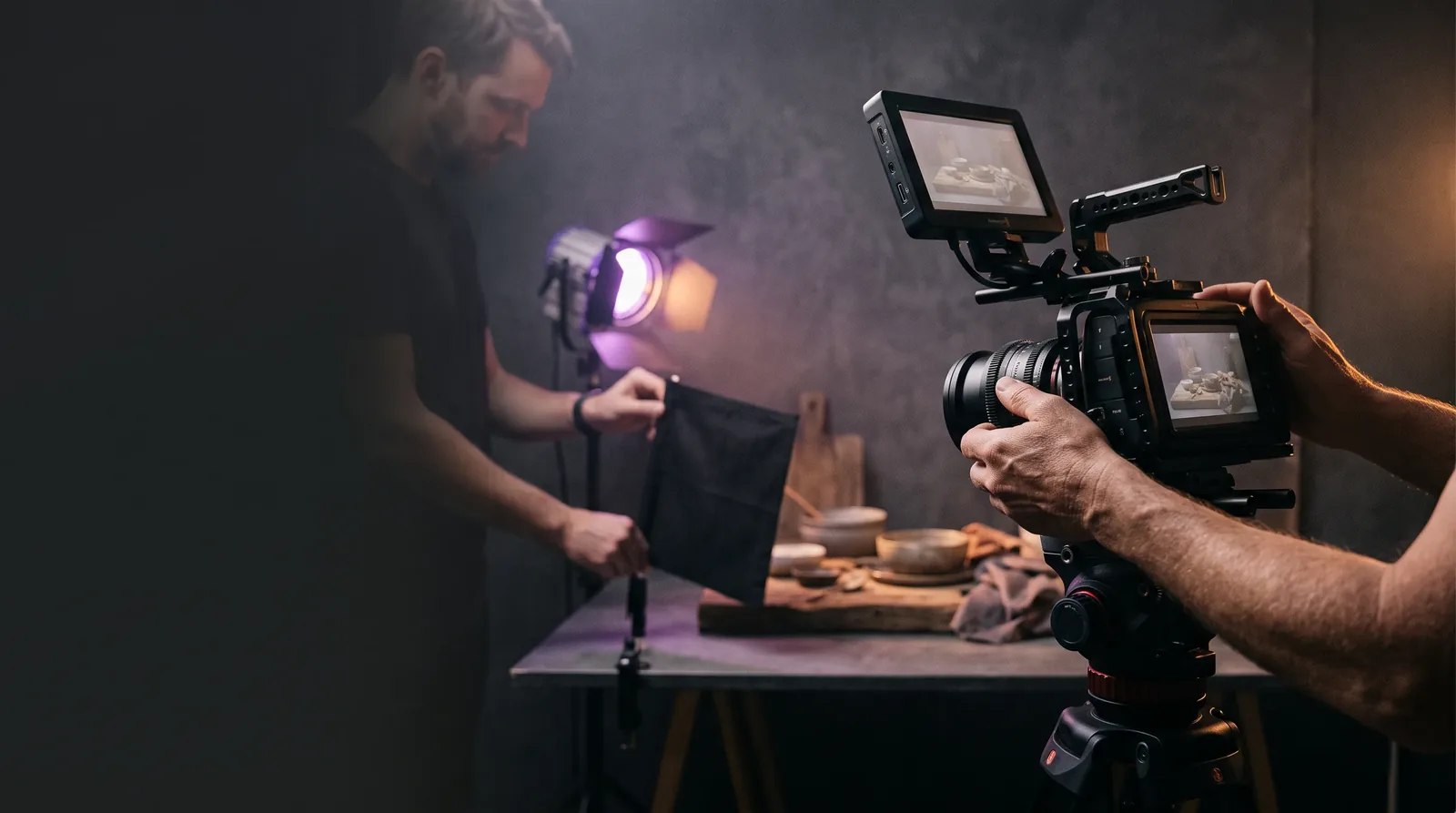 A compact production team carefully framing a short-form video